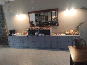 a counter with a mirror and some food on it at Hotel Alster in Jevíčko +20 photos