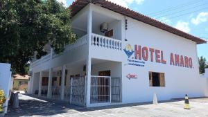 a building with a hotel name on the side of it at Hotel Amaro in Luis Correia