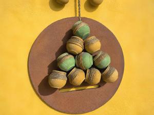 a group of clams on a plate on a yellow wall at Hotel Quinta Bella in Tula de Allende