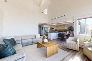 a living room with a couch and a table at Rita's-by-the-Sea in Moss Landing