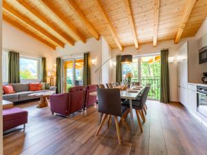 a living room with a table and chairs at Adlerblick in Werfenweng