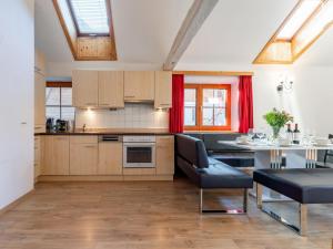 a kitchen with a table and a dining room at Zederhaus in Mariapfarr