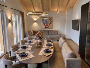 a living room with a table and a couch at Grebenzen 66 in Sankt Lambrecht