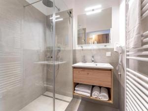 a bathroom with a sink and a glass shower at Grebenzen 66 in Sankt Lambrecht +22 photos