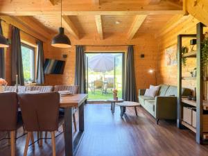 a living room with a table and a couch at Rattendorf 23B in Rattendorf
