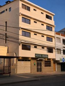 a hotel building on the corner of a street at Hotel Brasil in Antofagasta
