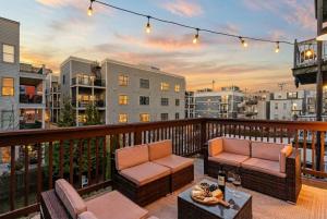 a balcony with two chairs and a table on a balcony at Sky Deck | Downtown in Boston