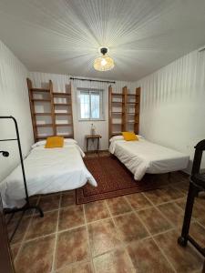 a room with two beds in a room at AT El Cordel in Nogales +6 photos