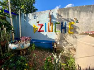 a sign for a zilla sign on a wall at HotelMariaAngela in Dzuiché