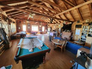 a large room with a table in a barn at Beaver Creek Guest Ranch in Blue