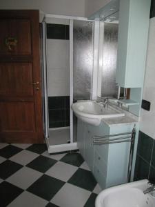 a bathroom with a sink and a shower and a toilet at Appartamento Le Jardin CIR VDA Aymavilles 0009 in Aymavilles