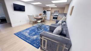 a living room with a couch and a table at Entire condo in White Rock, Canada in White Rock
