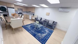 a living room with a couch and a table at Entire condo in White Rock, Canada in White Rock +12 photos