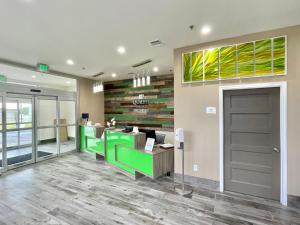 a lobby with a waiting room with a green counter at Quality Inn in Elgin