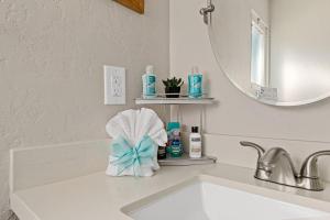 a bathroom counter with a sink and a mirror at Bear Sky Cabin in Big Bear City +47 photos