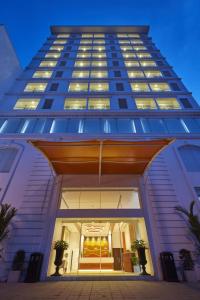 a tall building with a staircase in front of it at Mandarina Colombo in Colombo
