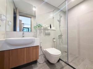 a bathroom with a sink and a toilet and a shower at Aquar Grand Park in Gò Công +86 photos