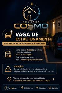 a sign for a car dealership in a parking lot at Pousada cosmo in Uberaba
