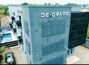 an aerial view of a building with the words de grants at Degrams Hotel and suites in Epe