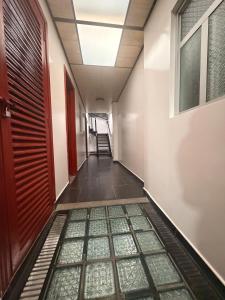 an empty hallway with a skylight in a building at Hotel Hostal Urban18 in Bogotá
