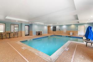 a large swimming pool in a hotel room at Holiday Inn Express Biddeford by IHG in Biddeford