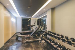 a gym with two chairs and a treadmill at Atour on the Bund in Shanghai