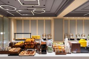 a buffet line in a hotel room with food at Atour on the Bund in Shanghai