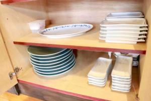 a cabinet filled with plates and dishes on a shelf at ラリックス蓼科 in Chino +154 photos