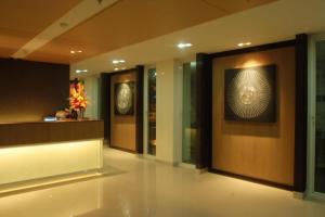 a lobby with a wall with a picture on it at Panatara Chumphon in Chumphon