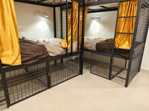 a couple of bunk beds in a room at Kerala dormitory edapally in Cochin