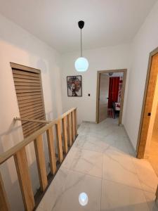 a hallway with a staircase and a pendant light at Apartamento completo punta cana in Punta Cana +1 photo