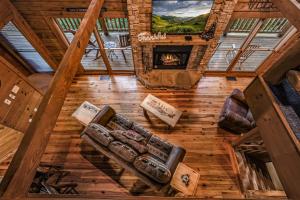 an overhead view of a living room with a fireplace at Absolute Bearadise cabin in Sevierville +41 photos