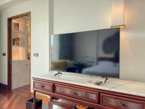 a large mirror on a wall in a room at Park Hyatt Siem Reap in Siem Reap