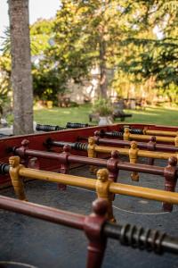 a row of wooden benches sitting in a park at Quinta del Pinar in Azul