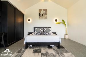 a bedroom with a bed and a potted plant at Villa Lyma by Bukit Vista in Pererenan +16 photos