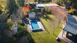 an aerial view of a house with a swimming pool at Manawa Retreat in Whitecliffs