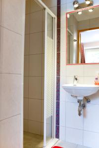 a bathroom with a sink and a mirror at Apartament Górski - Apartamentuj in Karpacz