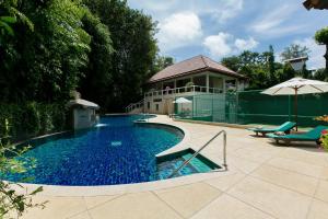 a swimming pool in a yard with a house at Katamanda Villa Jade A6 Seaview Kata Beach in Kata Beach