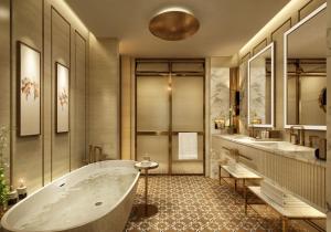 a bathroom with a tub and two sinks at The Theodore Hanoi in Hanoi +23 photos