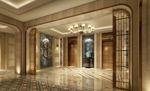 a lobby with a large chandelier and a staircase at The Theodore Hanoi in Hanoi