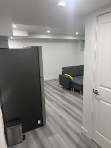 a living room with a tv and a couch at Peniel Place in Airdrie