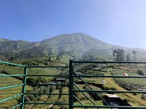 a view of a valley with mountains in the background at 1440 MDPL Villa & Resort in Wonosobo