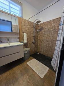 a bathroom with a sink and a shower at Baywatch Apartment in La Gaulette +78 photos