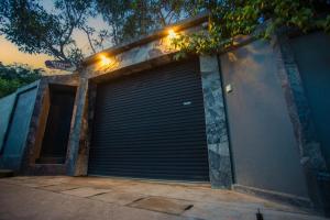 a large garage door with lights on top of it at Wenzel Villa in Hikkaduwa