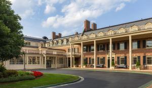 a large brick building with a lot of windows at The Carolina Inn, a Destination by Hyatt Hotel in Chapel Hill