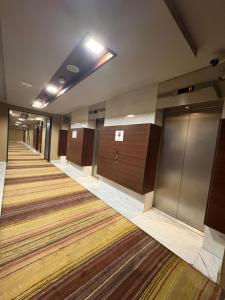 a row of lockers in a hallway in a building at Apartmani delux in Sarajevo +11 photos