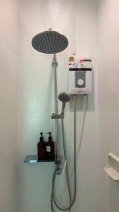 a shower in a bathroom with a shower head at Alura Boutique in Kata Beach +107 photos