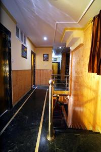 a bowling alley with a table in a room at Hotel King Palace in Shimla