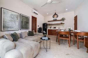 a living room with a couch and a table at Modern 1BR with Spacious Living Room in Uluwatu