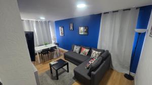 a living room with a couch and a table at Totteham stadium in London